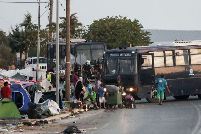 World News: Greece police moves migrants into Lesbos tent camp after fire